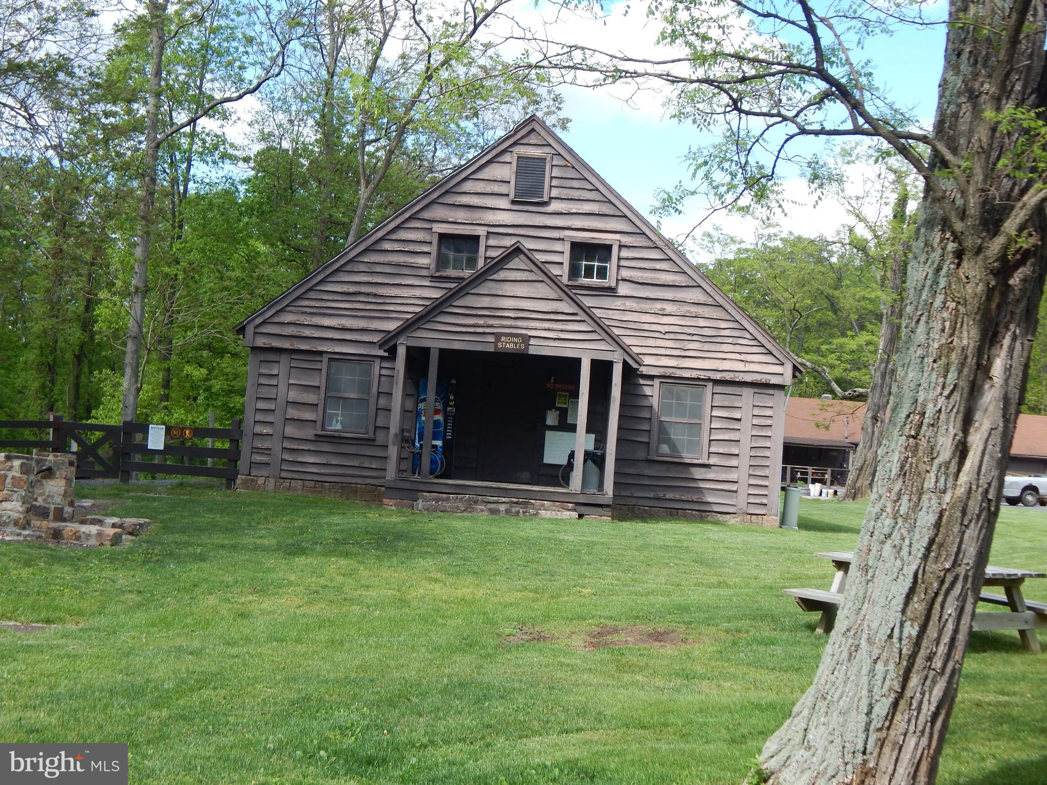 Plum Tree Lane Berkeley Springs, WV 25411 - Photo 22 of 51 a front view of a house with a yard