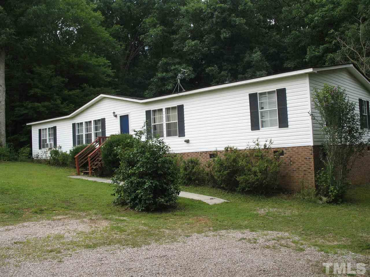 145 Ridgewood Drive Middlesex, NC 27557 - Photo 2 of 20 a house that has a lot of plants in it