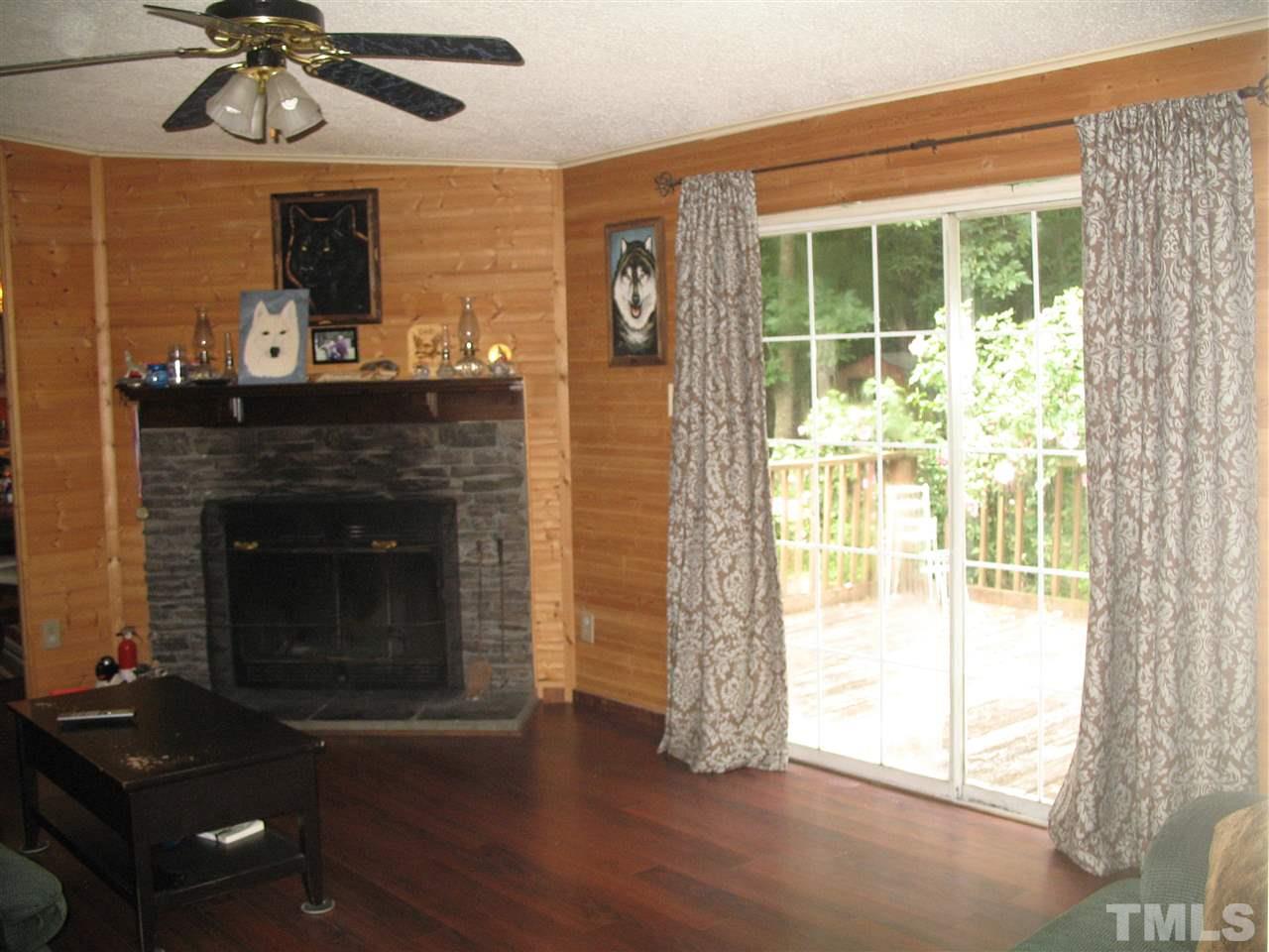 145 Ridgewood Drive Middlesex, NC 27557 - Photo 12 of 20 a living room with furniture and a fireplace