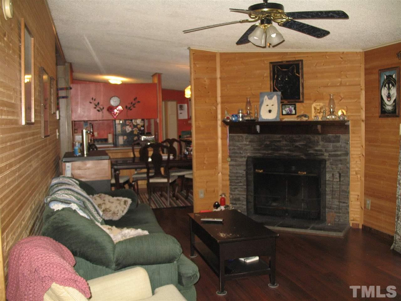 145 Ridgewood Drive Middlesex, NC 27557 - Photo 13 of 20 a living room with furniture and a fireplace