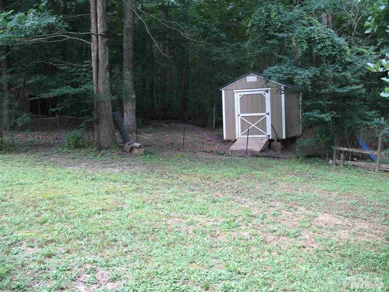145 Ridgewood Drive Middlesex, NC 27557 - Photo 3 of 20 a backyard of a house with lots of green space