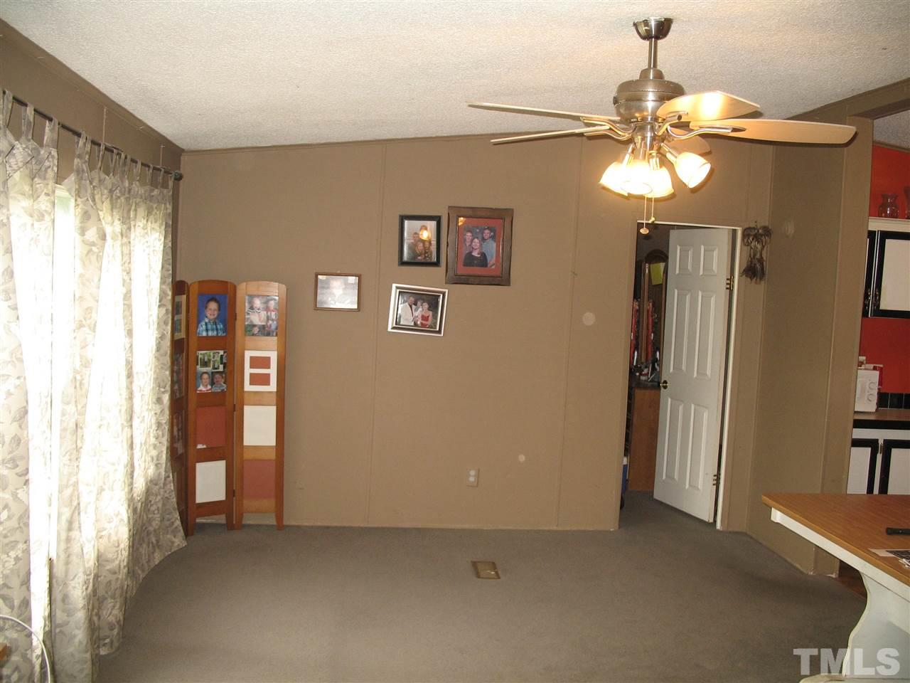 145 Ridgewood Drive Middlesex, NC 27557 - Photo 8 of 20 a view of an empty room with a window