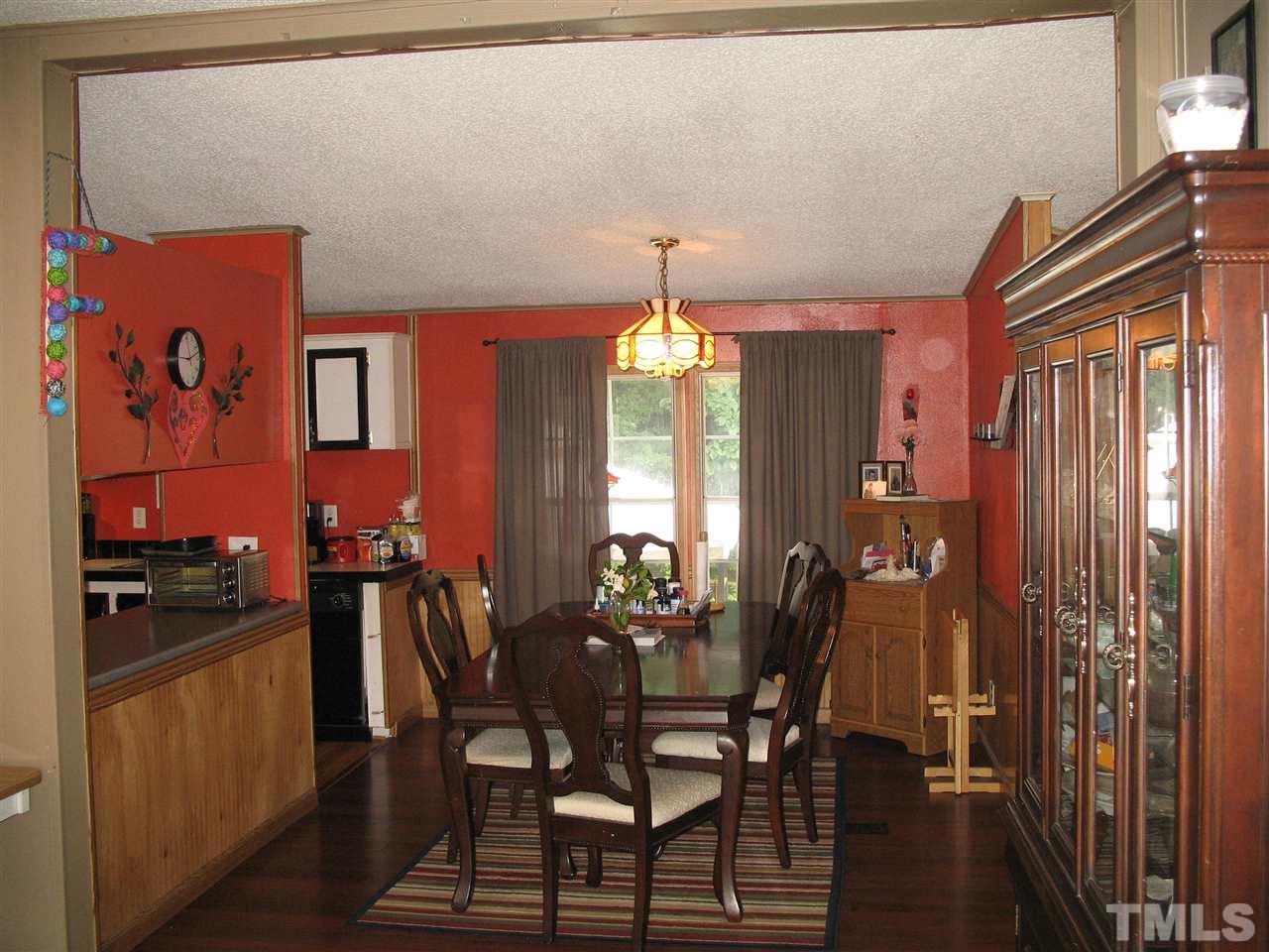 145 Ridgewood Drive Middlesex, NC 27557 - Photo 10 of 20 a view of a dining room with furniture and window