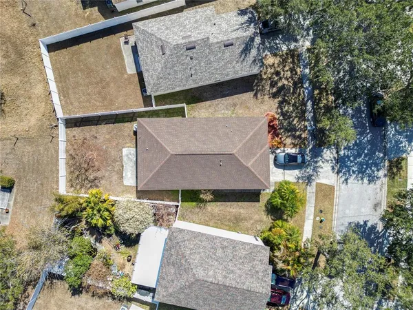 an aerial view of a house having yard