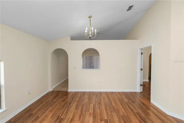 a view of an entryway with wooden floor