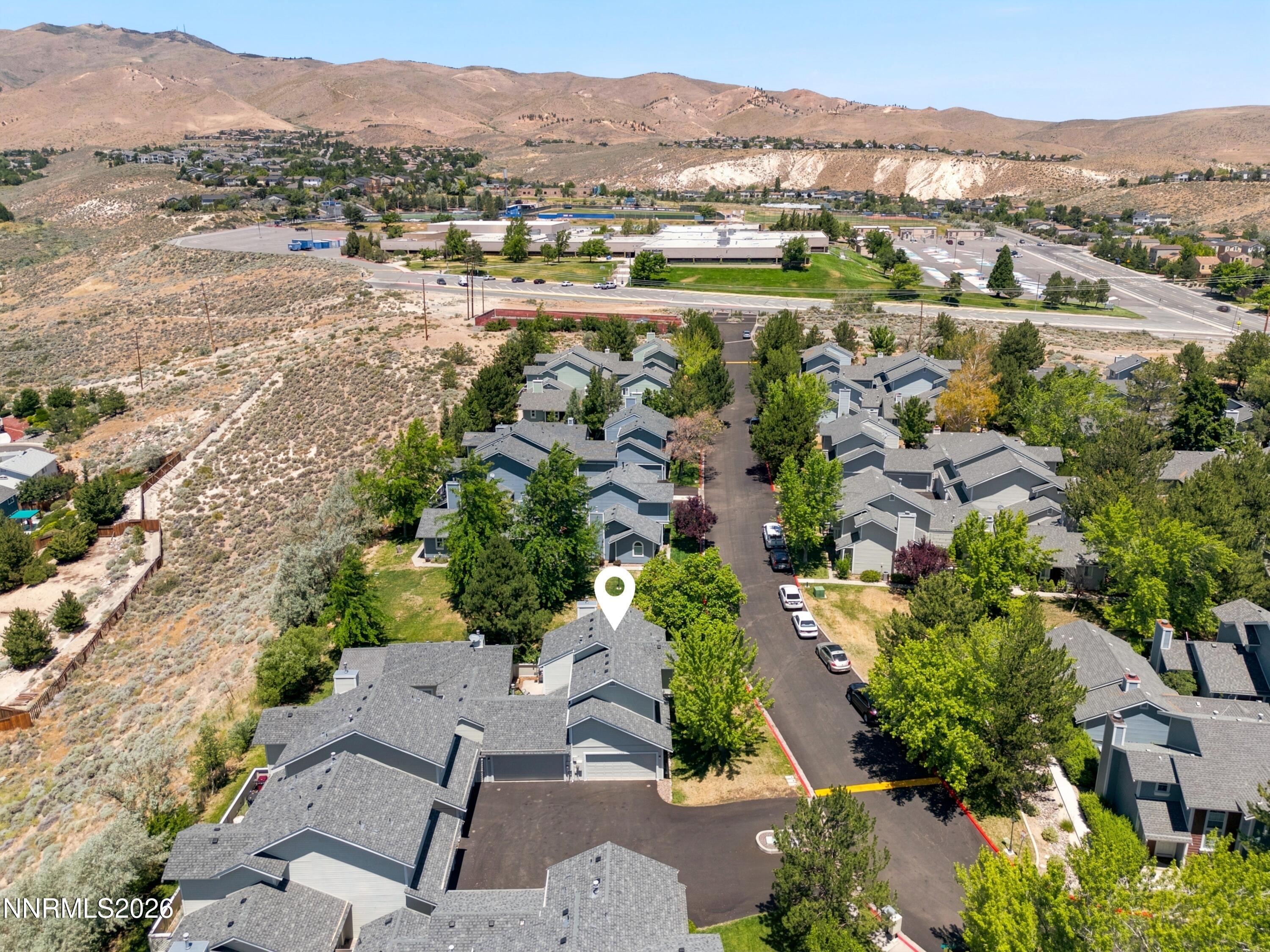 1899 Tuolumne Drive Reno, NV 89523 - Photo 2 of 44 an aerial view of residential houses with outdoor space and river