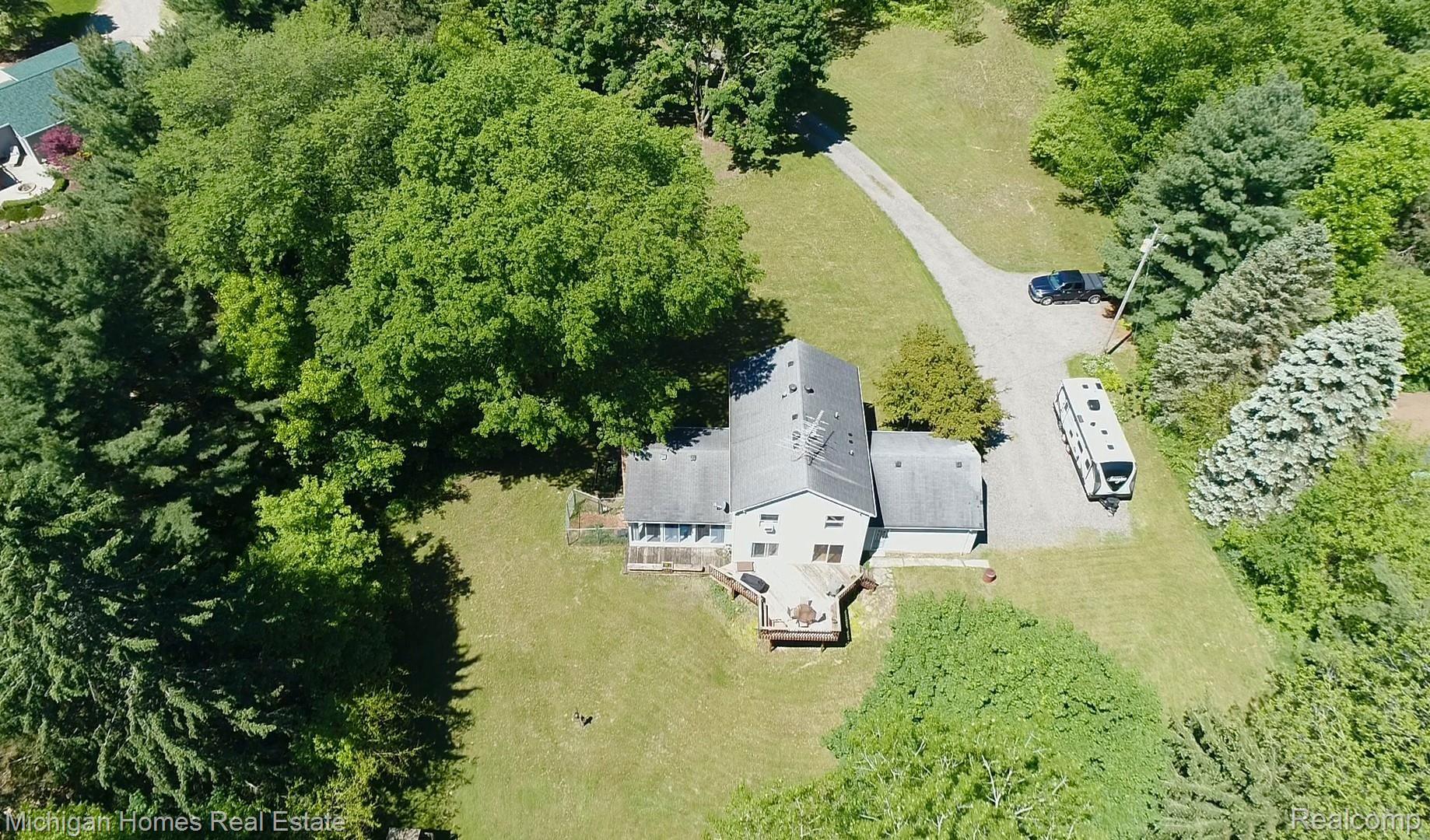 9198 Gould Road Linden, MI 48451 - Photo 41 of 56 ENOUGH ROOM IN YOUR DRIVEWAY FOR AN RV! NOTICE THE WOODED PRIVACY