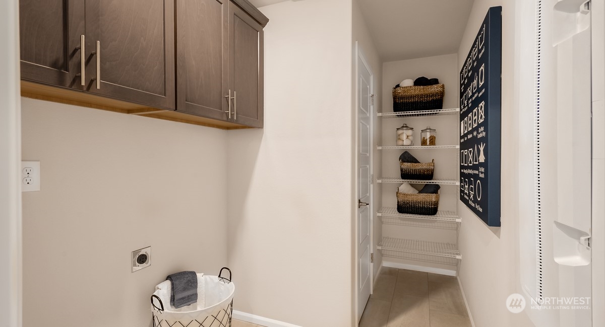 4130 235th Place Southeast, Unit 44 Bothell, WA 98021 - Photo 11 of 19 a kitchen with a refrigerator and a stove