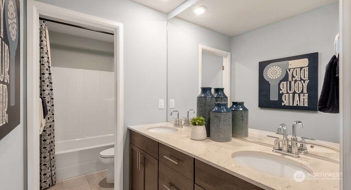 4130 235th Place Southeast, Unit 44 Bothell, WA 98021 - Photo 12 of 19 a bathroom with a granite countertop sink toilet and shower