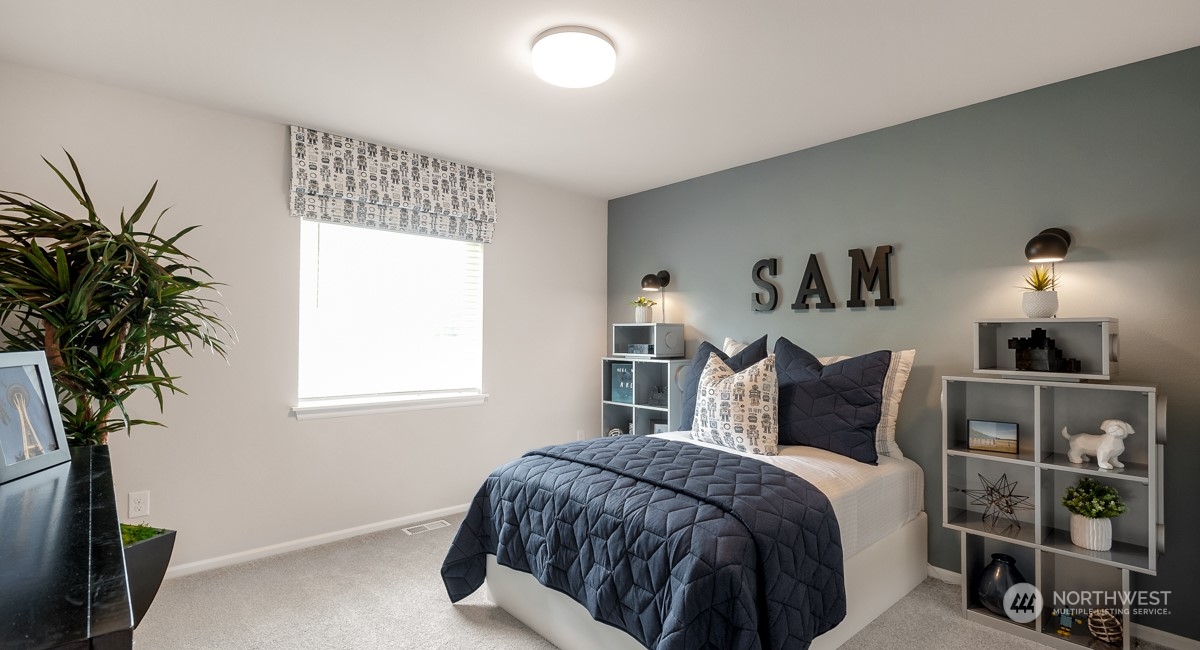 4130 235th Place Southeast, Unit 44 Bothell, WA 98021 - Photo 15 of 19 a bedroom with a bed and a potted plant