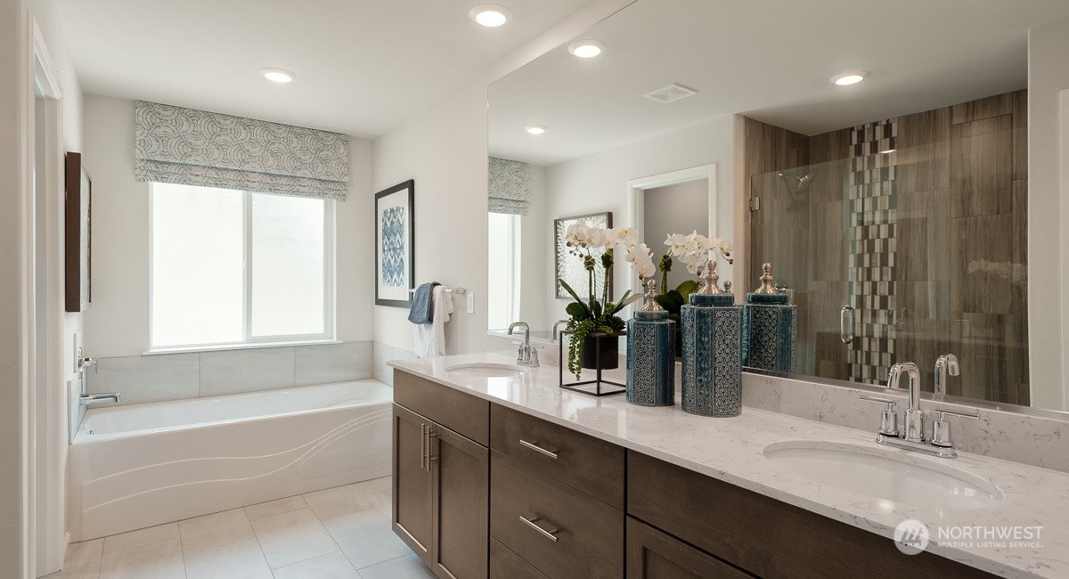 4130 235th Place Southeast, Unit 44 Bothell, WA 98021 - Photo 16 of 19 a bathroom with a double vanity sink and a bathtub