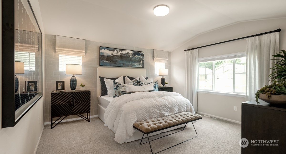 4130 235th Place Southeast, Unit 44 Bothell, WA 98021 - Photo 18 of 19 a bedroom with a bed and a couch