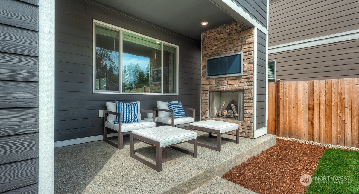4130 235th Place Southeast, Unit 44 Bothell, WA 98021 - Photo 19 of 19 a outdoor space with a couch and a fireplace