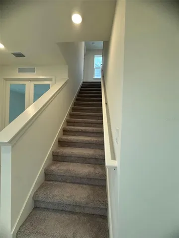 a bathroom with a double vanity sink and mirror
