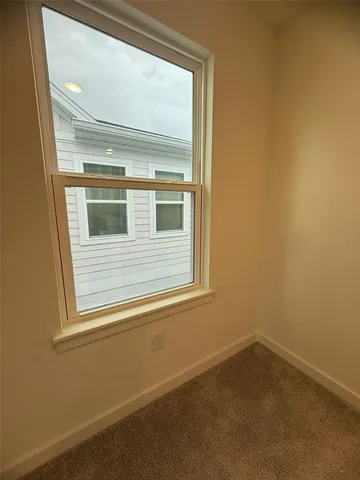 a view of a kitchen with a sink and cabinets