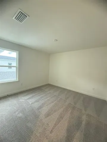 a white toilet sitting next to a bath tub and a shower