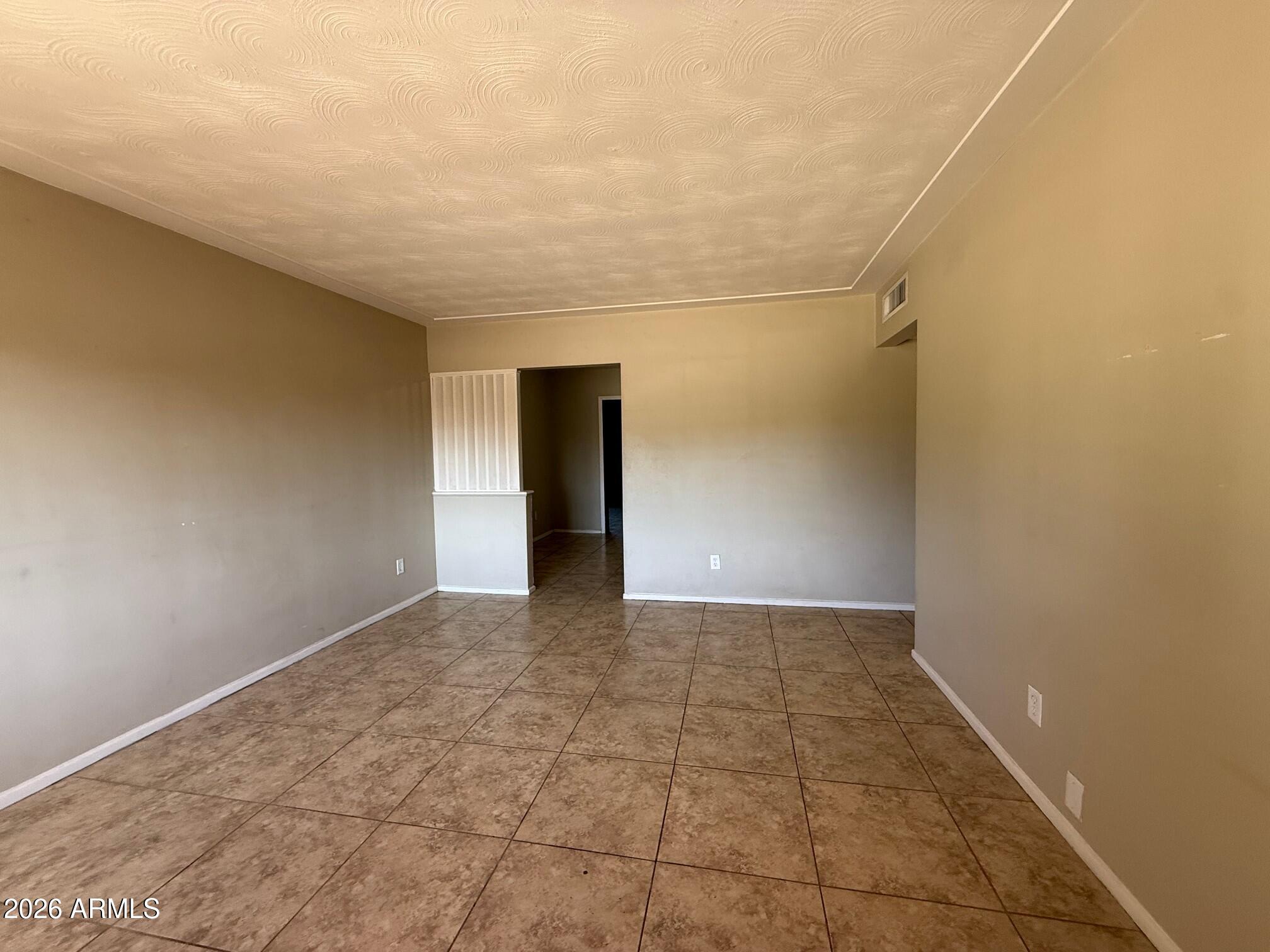 4447 East Almeria Road Phoenix, AZ 85008 - Photo 2 of 9 a view of an empty room