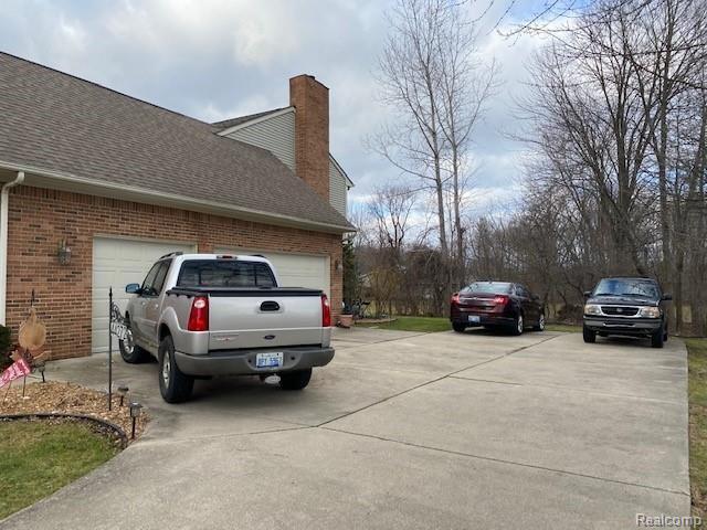 44272 Palmer Road Canton, MI 48188 - Photo 40 of 49 Large driveway to side entrance garage.
