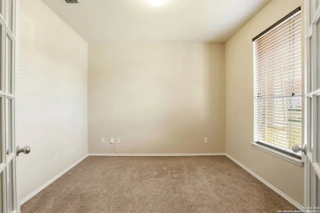 an empty room with windows