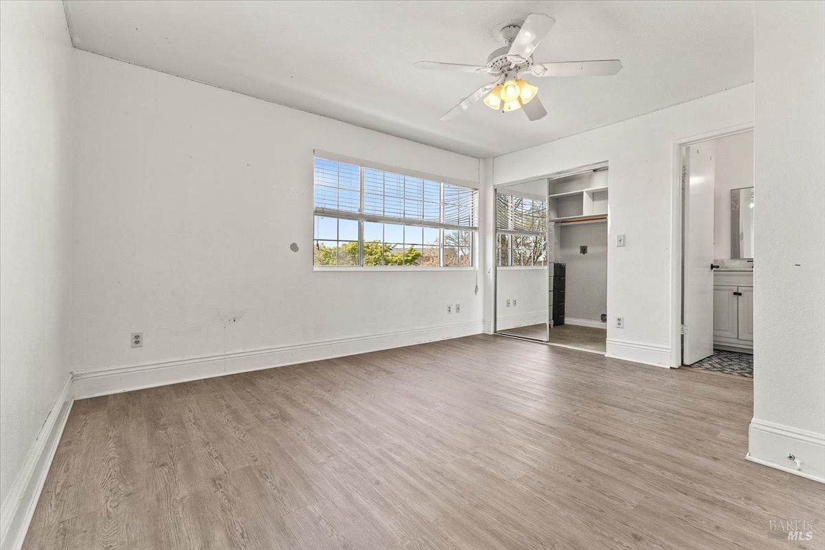 4457 Graywhaler Lane Rohnert Park, CA 94928 - Photo 23 of 51 an empty room with a window and a ceiling fan