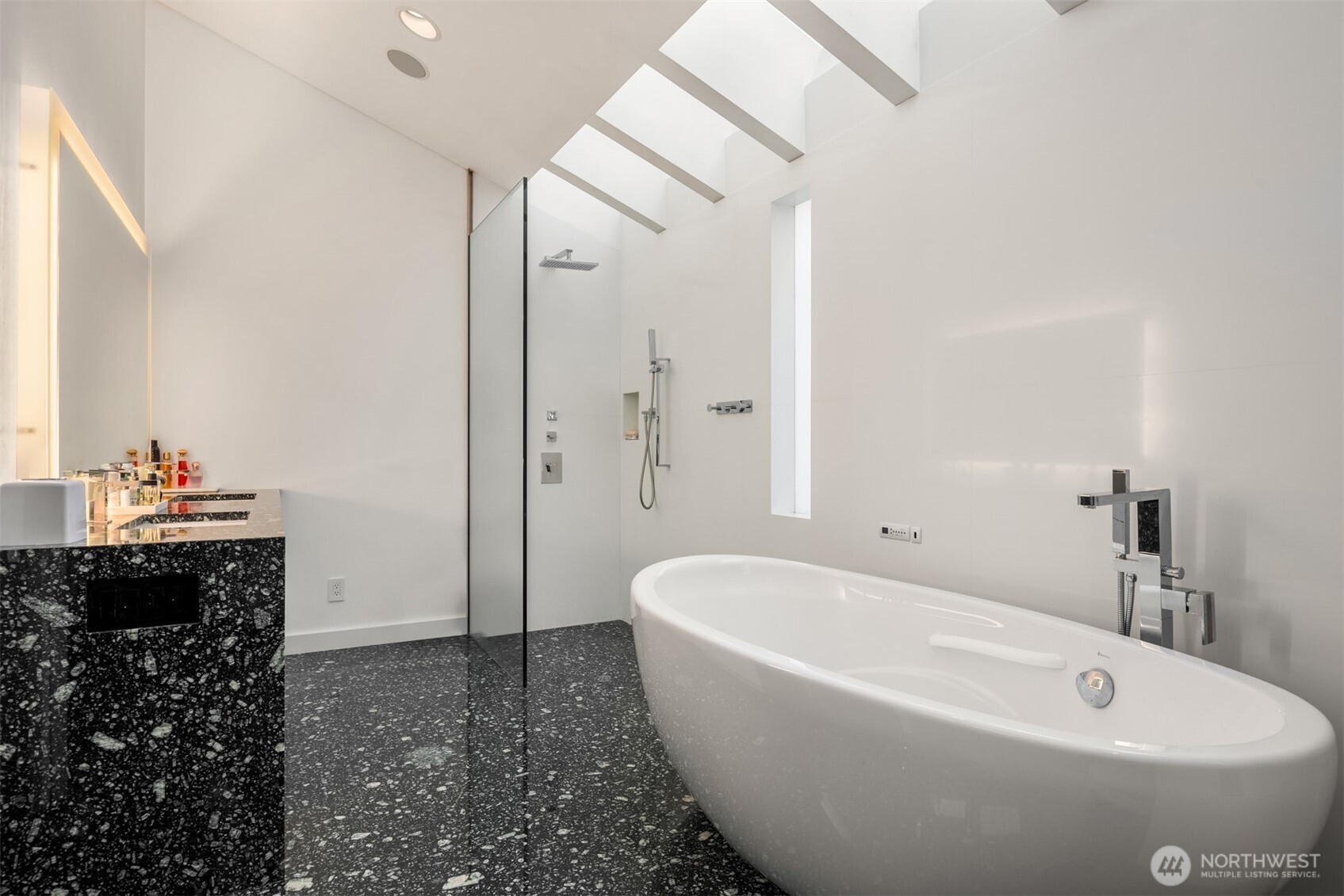 1615 39th Avenue East Seattle, WA 98112 - Photo 19 of 37 a bathroom with a bathtub and a sink