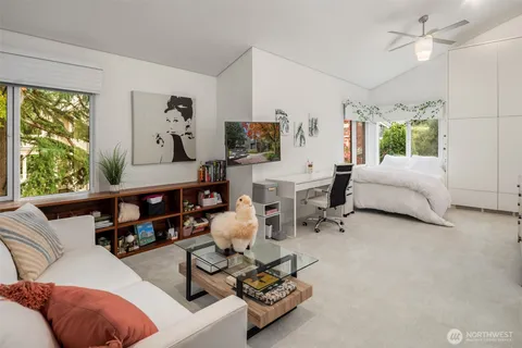a bathroom with a shower sink and mirror