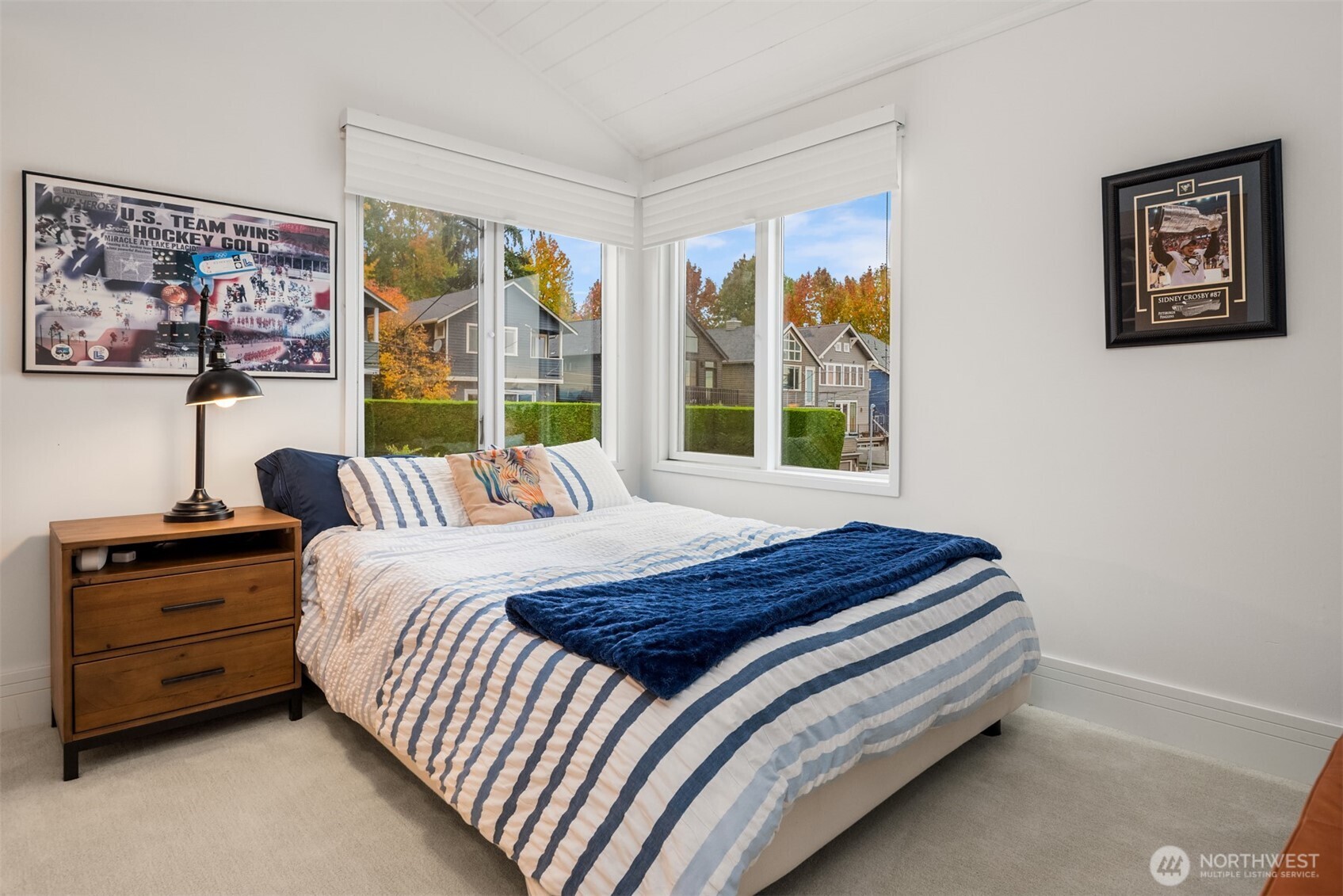 1615 39th Avenue East Seattle, WA 98112 - Photo 24 of 37 a bedroom with a bed and a large window