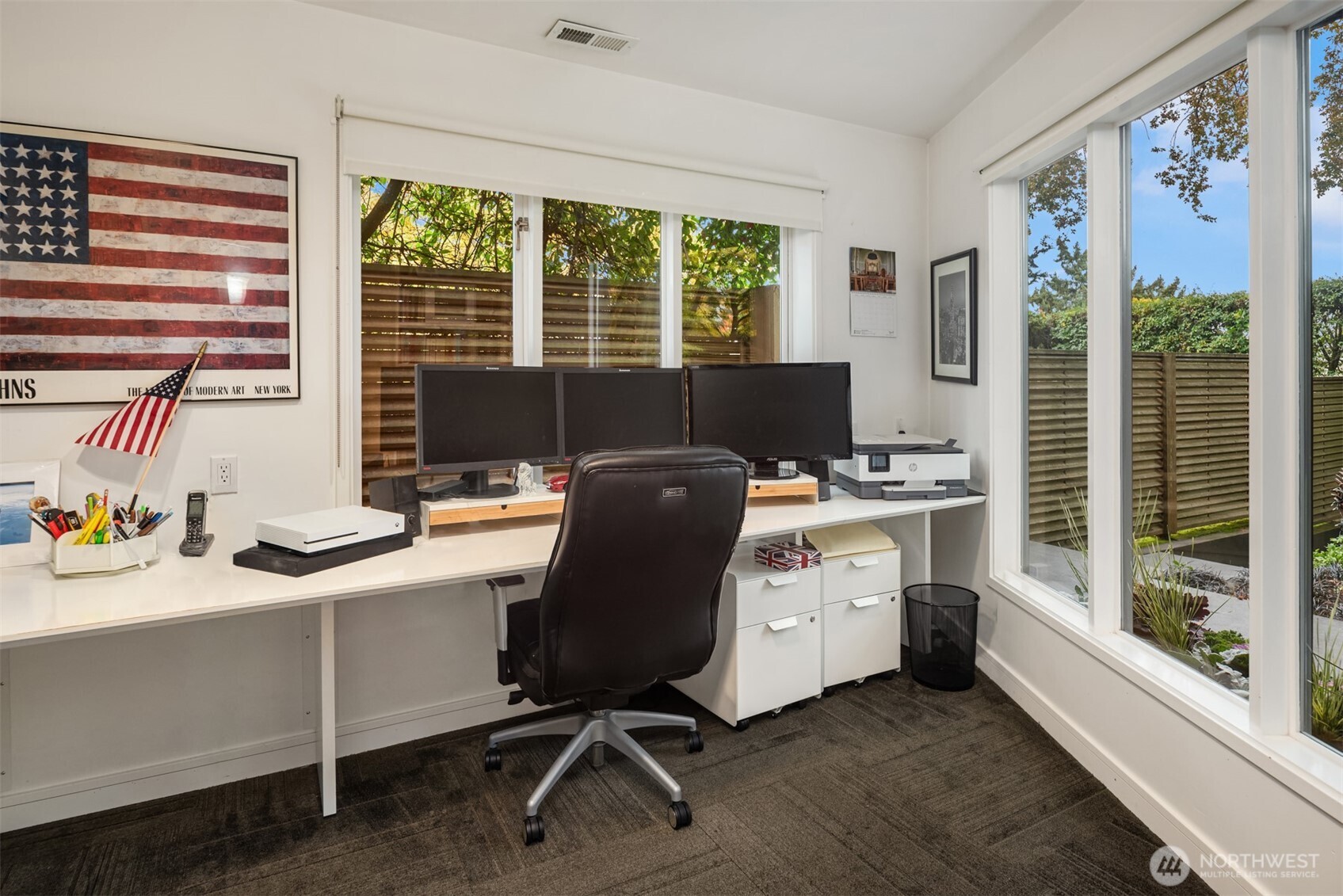 1615 39th Avenue East Seattle, WA 98112 - Photo 25 of 37 a view of a workspace with furniture and a window