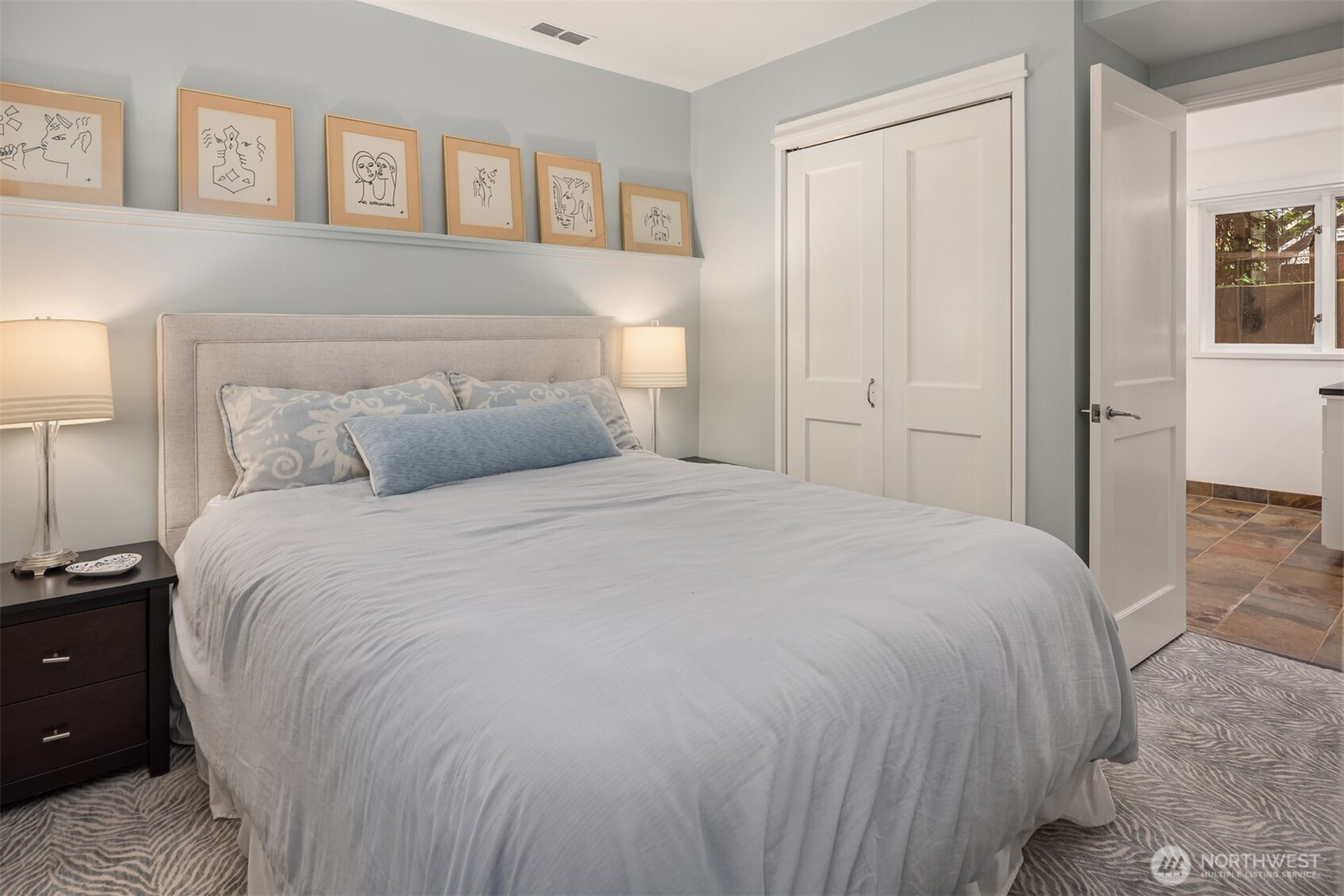 1615 39th Avenue East Seattle, WA 98112 - Photo 27 of 37 a bedroom with a bed and night stand