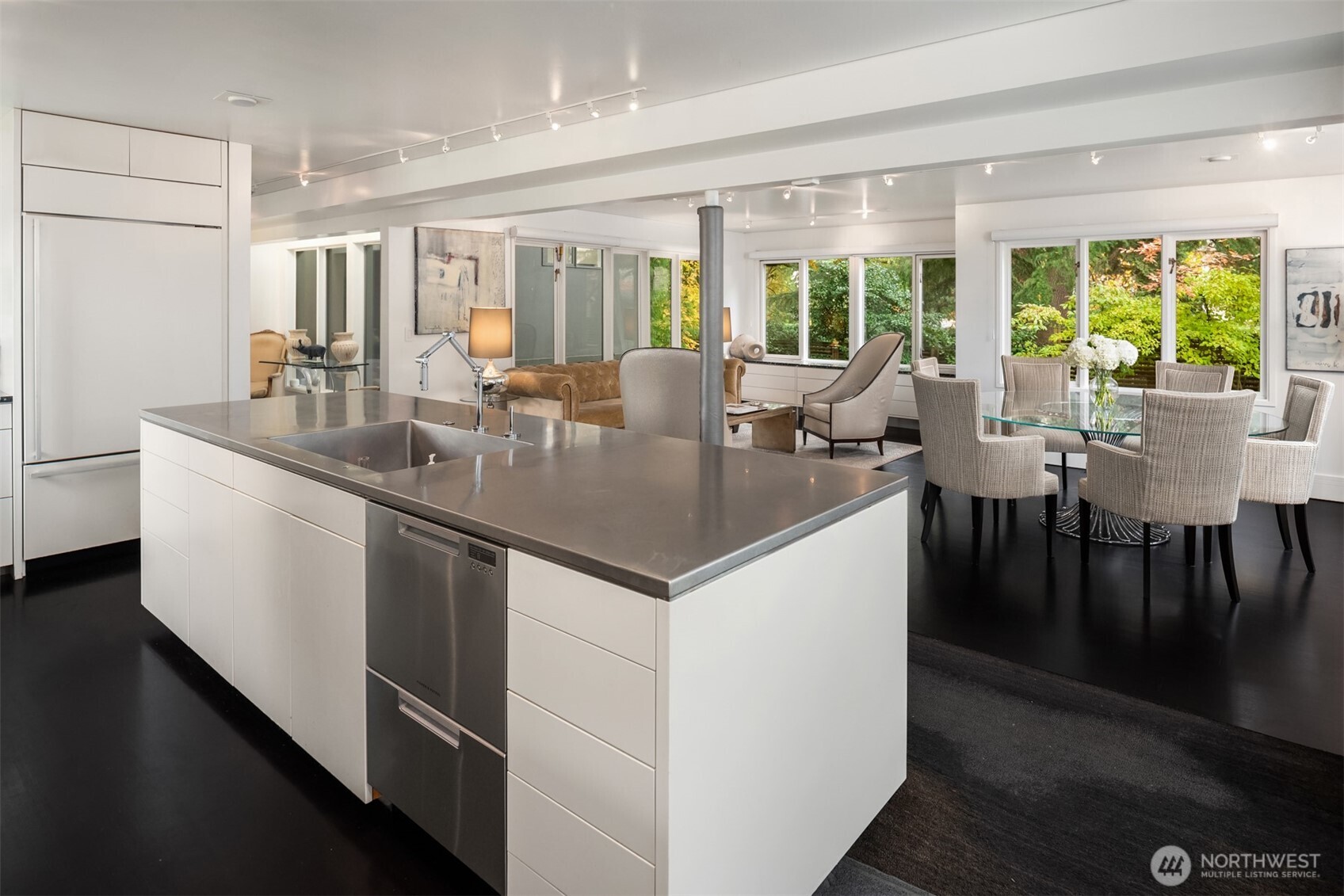 1615 39th Avenue East Seattle, WA 98112 - Photo 4 of 37 a kitchen with center island table and chairs