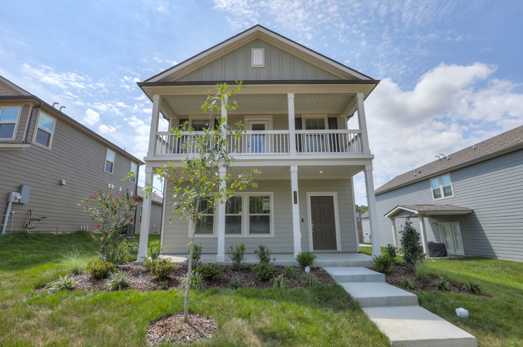 front view of a house with a yard