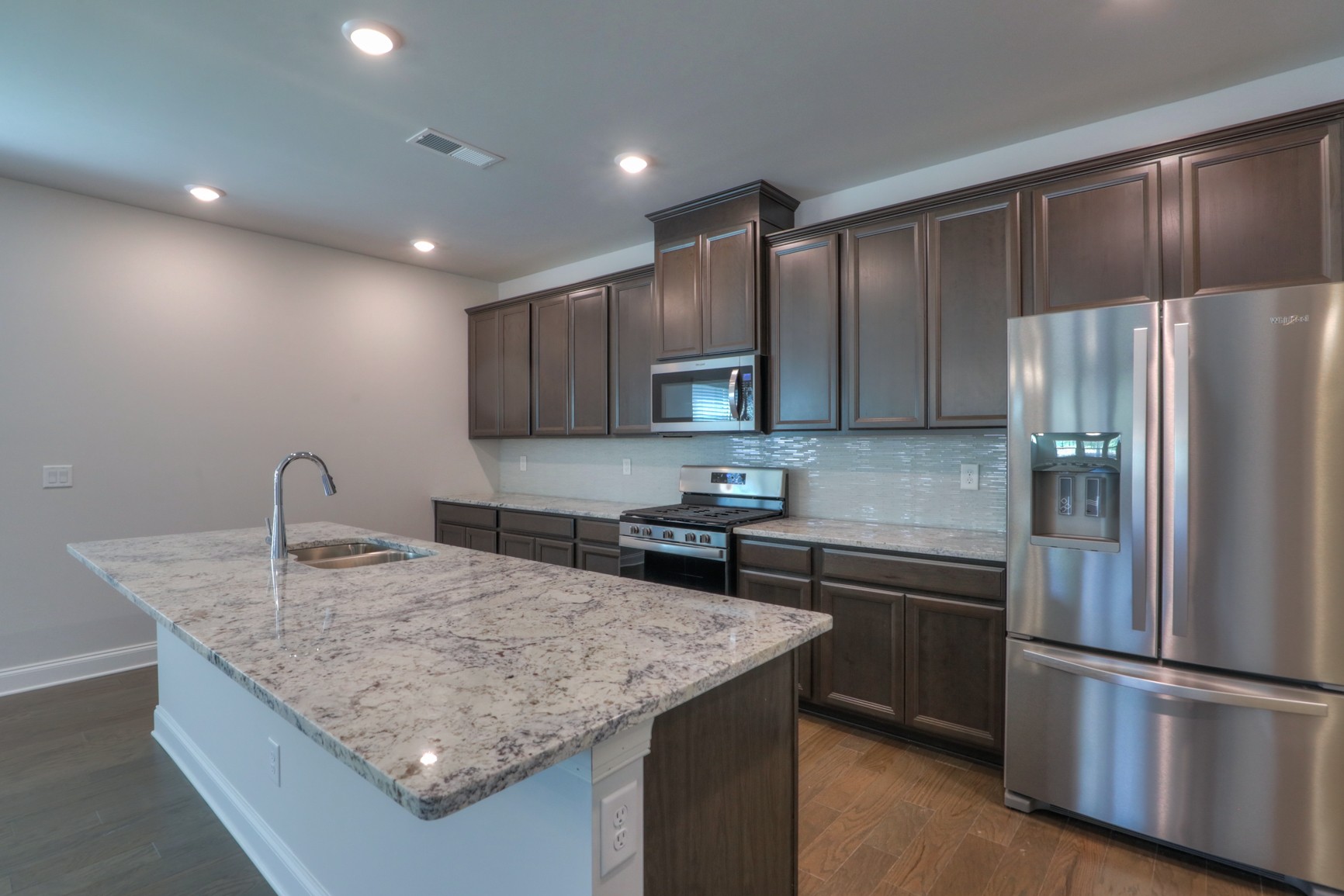 3546 Four Leaf Way Antioch, TN 37013 - Photo 12 of 35 a kitchen with kitchen island a counter top space cabinets stainless steel appliances and cabinets