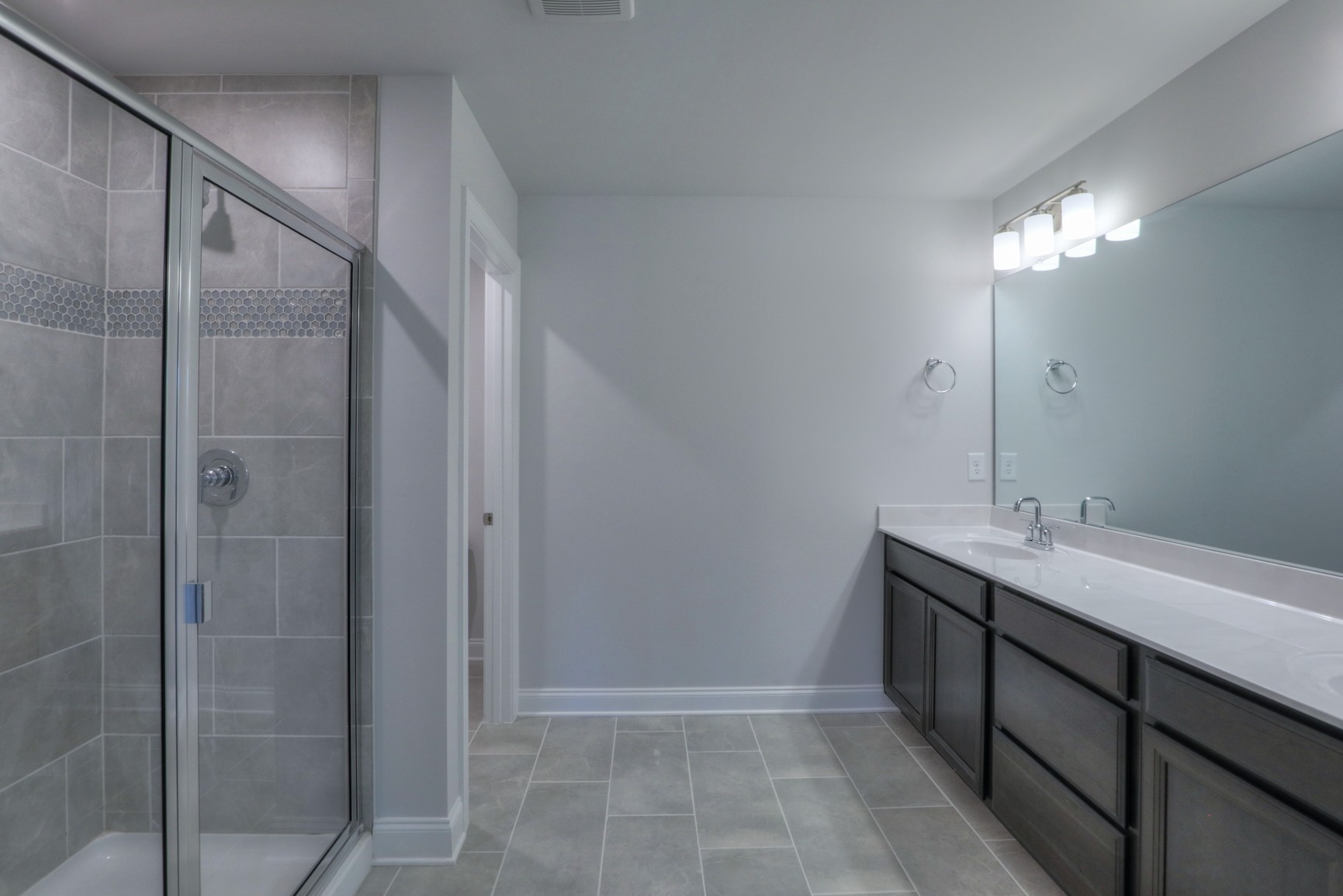 3546 Four Leaf Way Antioch, TN 37013 - Photo 19 of 35 a bathroom with a double vanity sink and a mirror