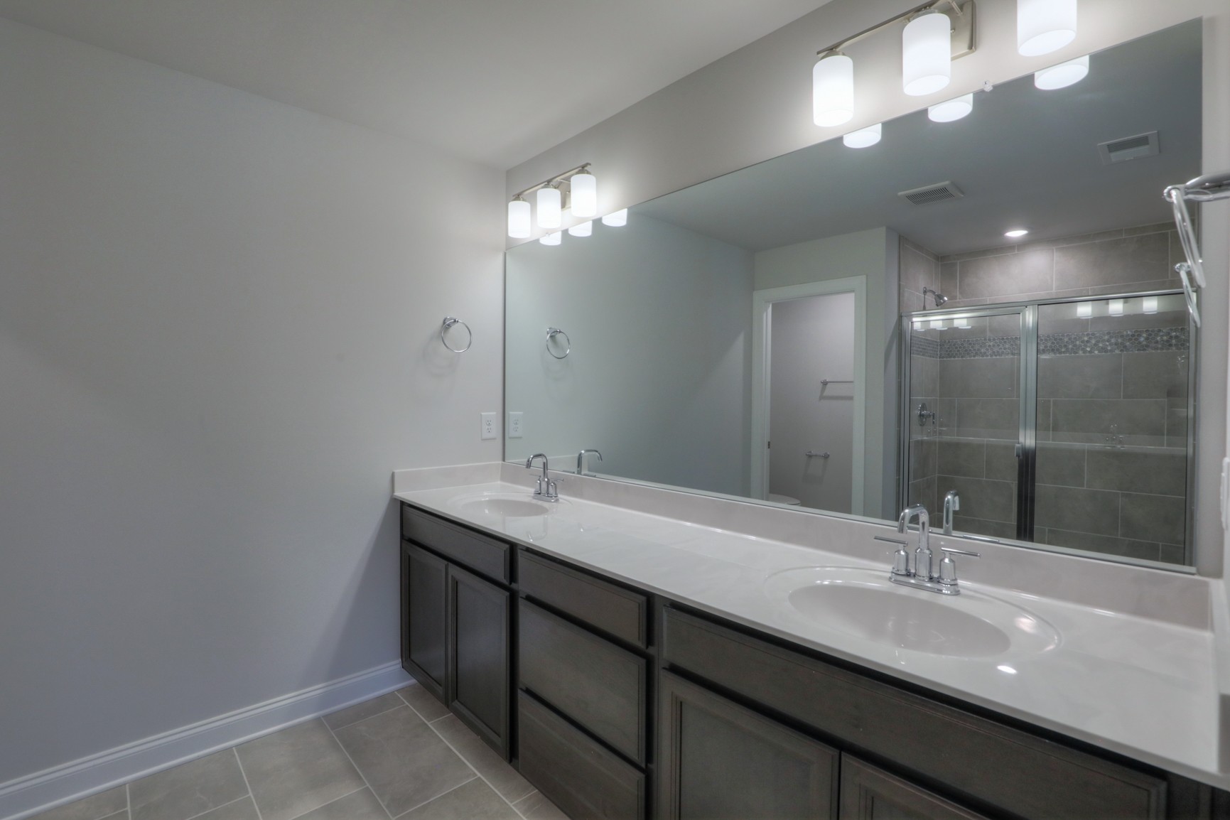 3546 Four Leaf Way Antioch, TN 37013 - Photo 20 of 35 a bathroom with double vanity sinks and a mirror