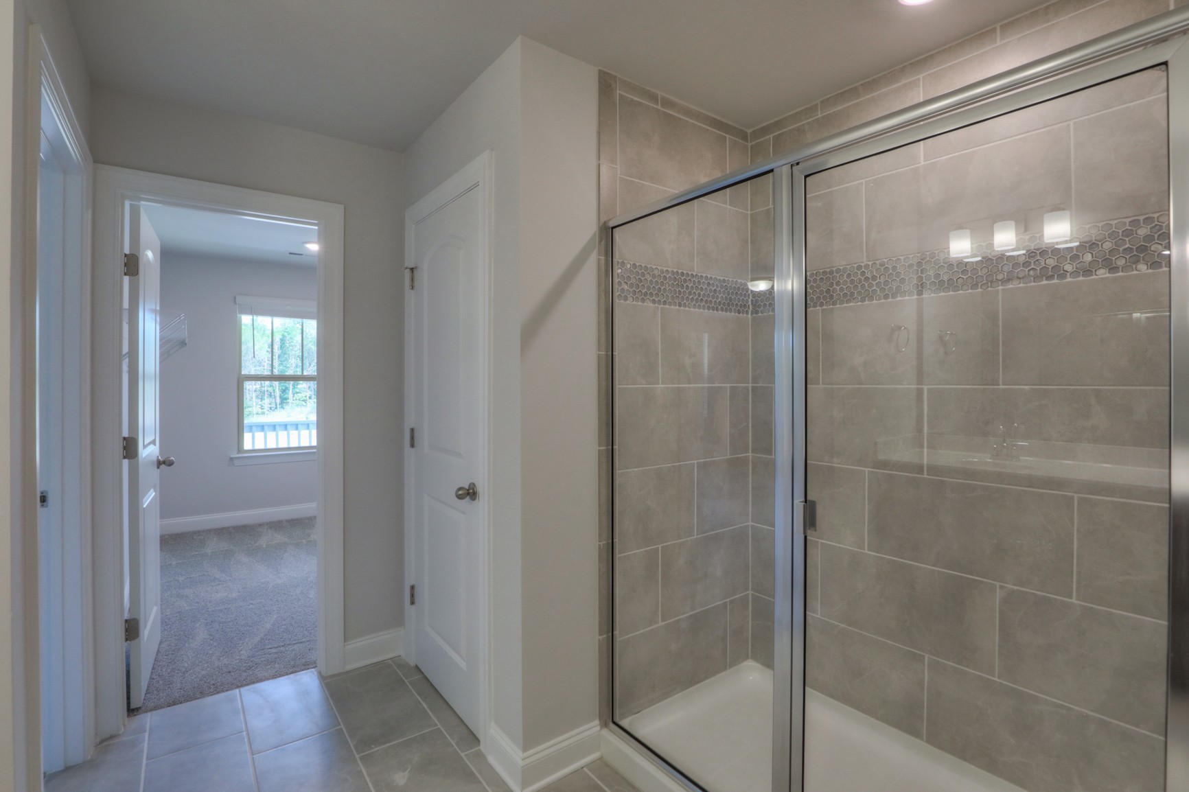 3546 Four Leaf Way Antioch, TN 37013 - Photo 21 of 35 a bathroom that has a glass shower door