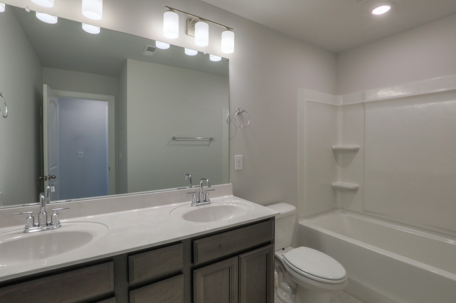 3546 Four Leaf Way Antioch, TN 37013 - Photo 27 of 35 a bathroom with a sink a toilet a mirror and shower