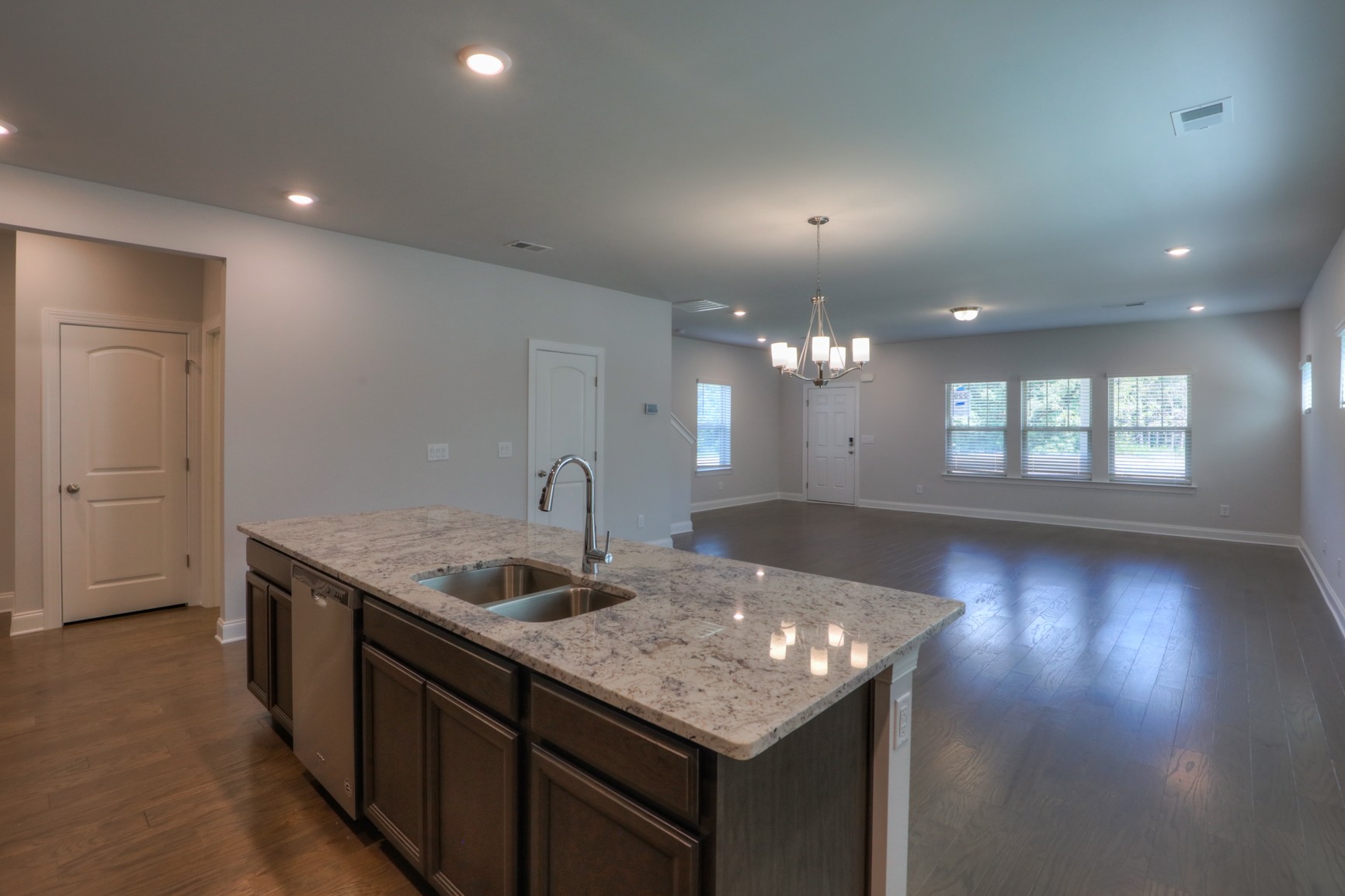 3546 Four Leaf Way Antioch, TN 37013 - Photo 10 of 35 a kitchen with a sink chandelier and wooden floor