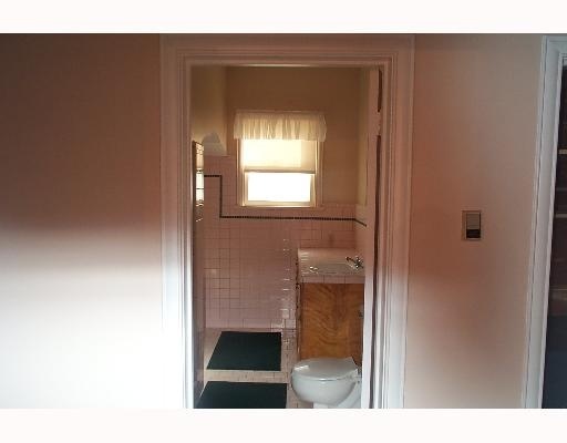 402 Atlantic Street Corpus Christi, TX 78404 - Photo 7 of 9 a bathroom with a sink and a mirror