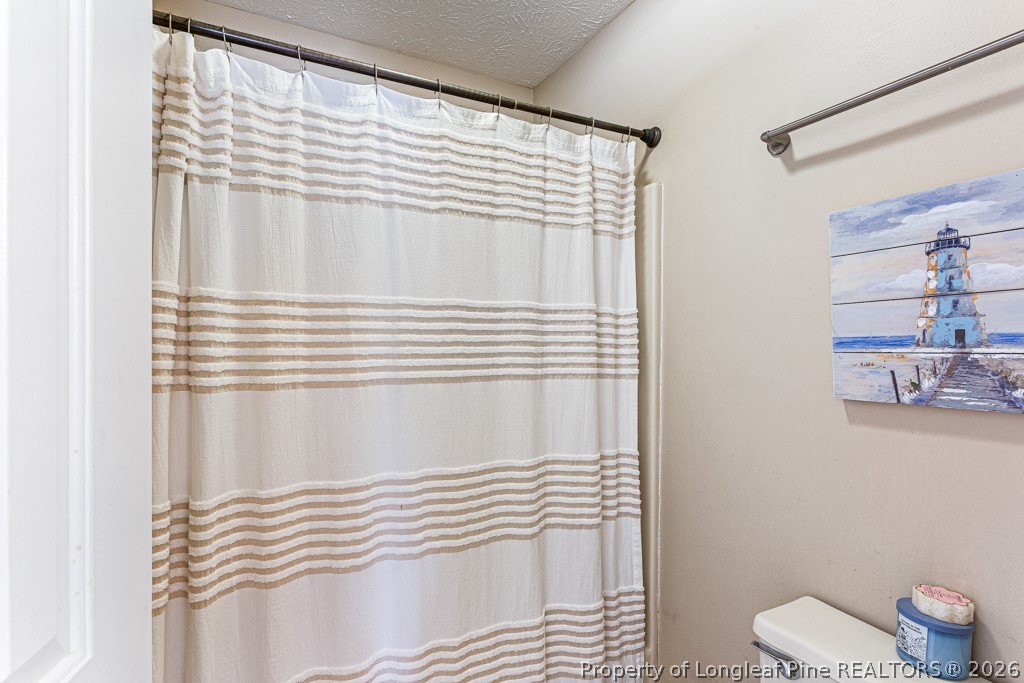 461 Lands End Road Fayetteville, NC 28314 - Photo 21 of 31 a bathroom with a sink and toilet
