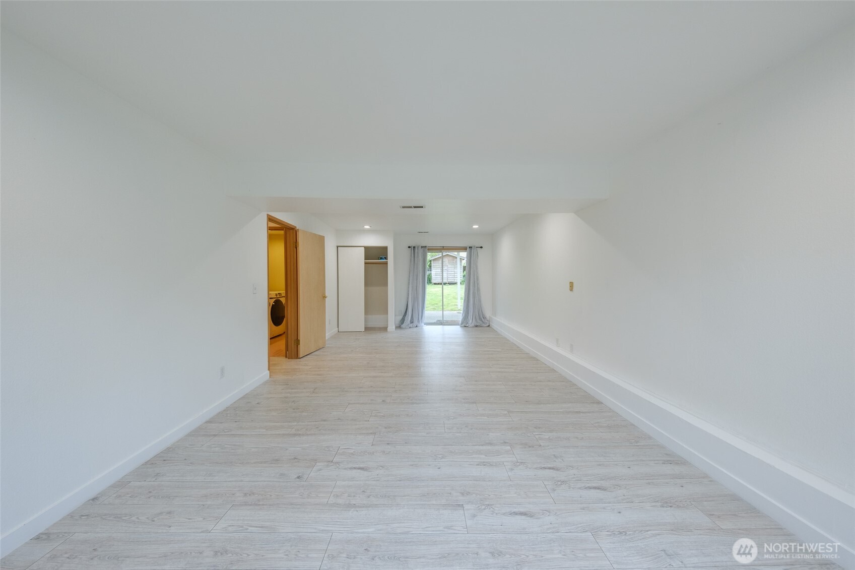 830 234th Street Southeast Bothell, WA 98021 - Photo 18 of 26 a view of an empty room with wooden floor