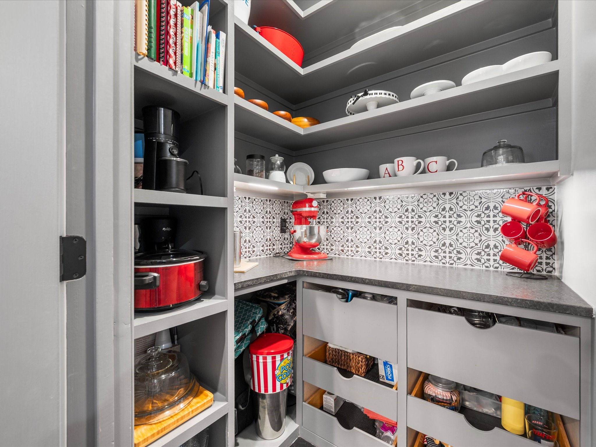 5910 Center Ct Drive Spring, TX 77379 - Photo 18 of 50 A well-appointed butler pantry offers abundant cabinetry, drawers, and counter space, providing exceptional storage and prep flexibility.