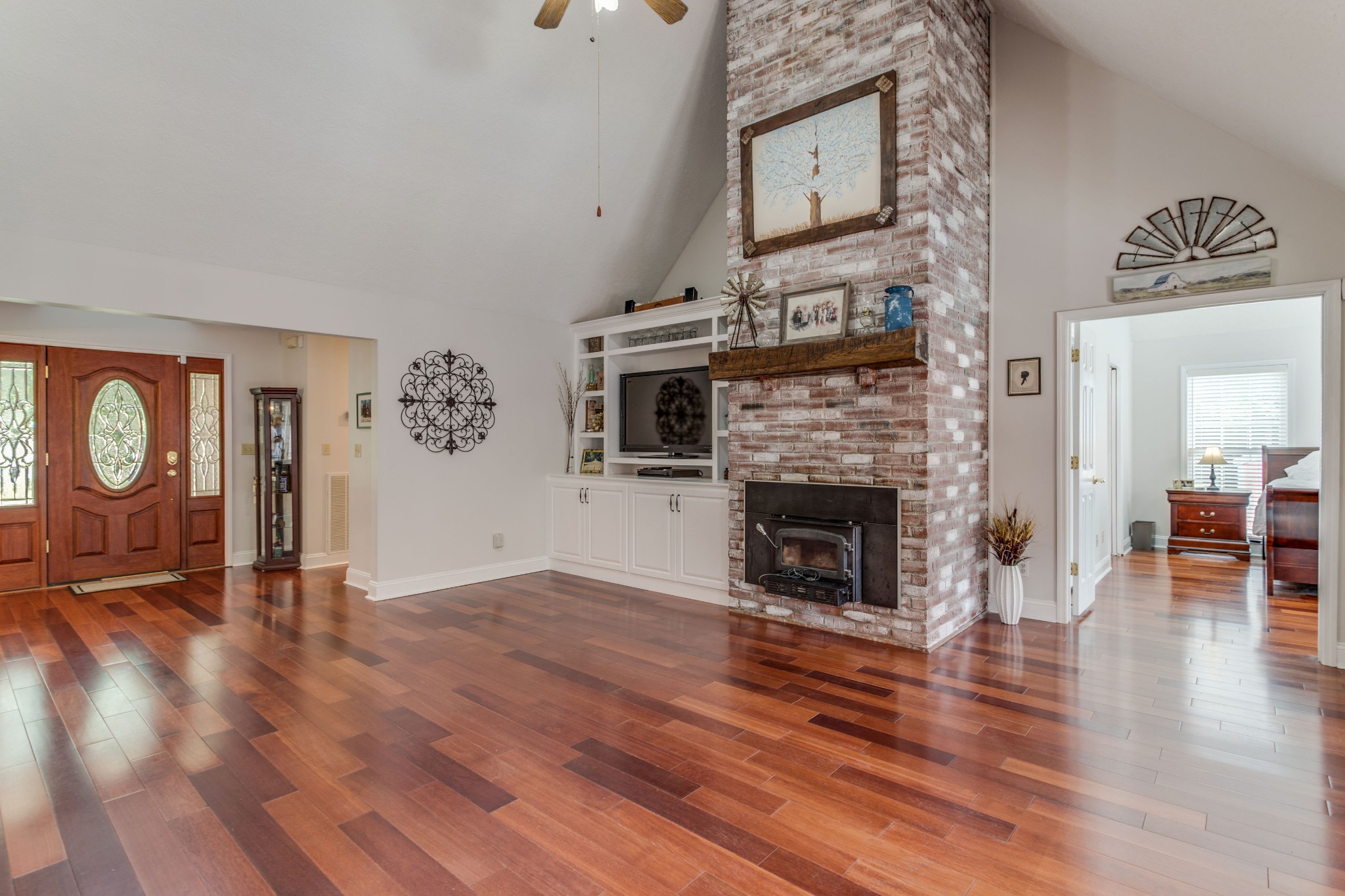 844 Ed Sanders Road Lynchburg, TN 37352 - Photo 11 of 46 a view of a livingroom with wooden floor and a fireplace