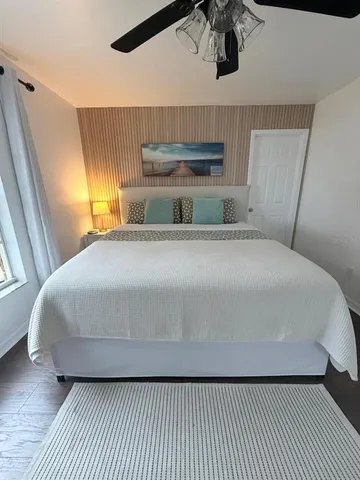 a bedroom with a bed and window