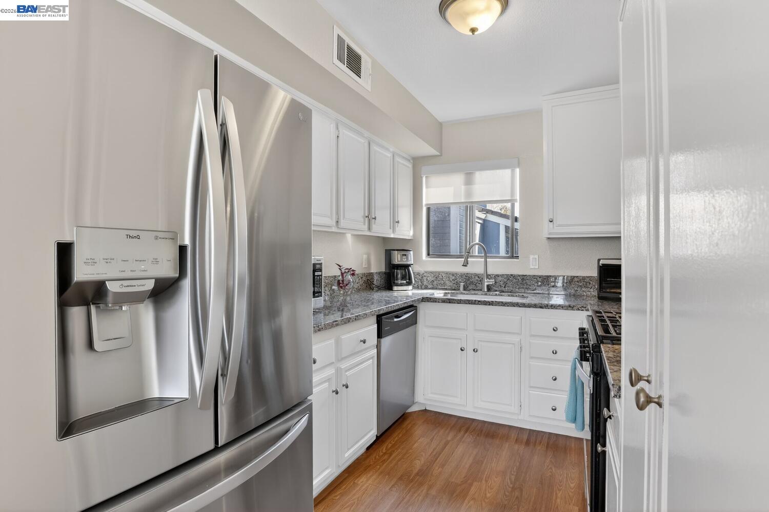 218 Apollo, Unit 3 Hercules, CA 94547 - Photo 13 of 36 Features light laminate floors, stainless steel appliances, white shaker cabinets, granite counter tops and backsplash.