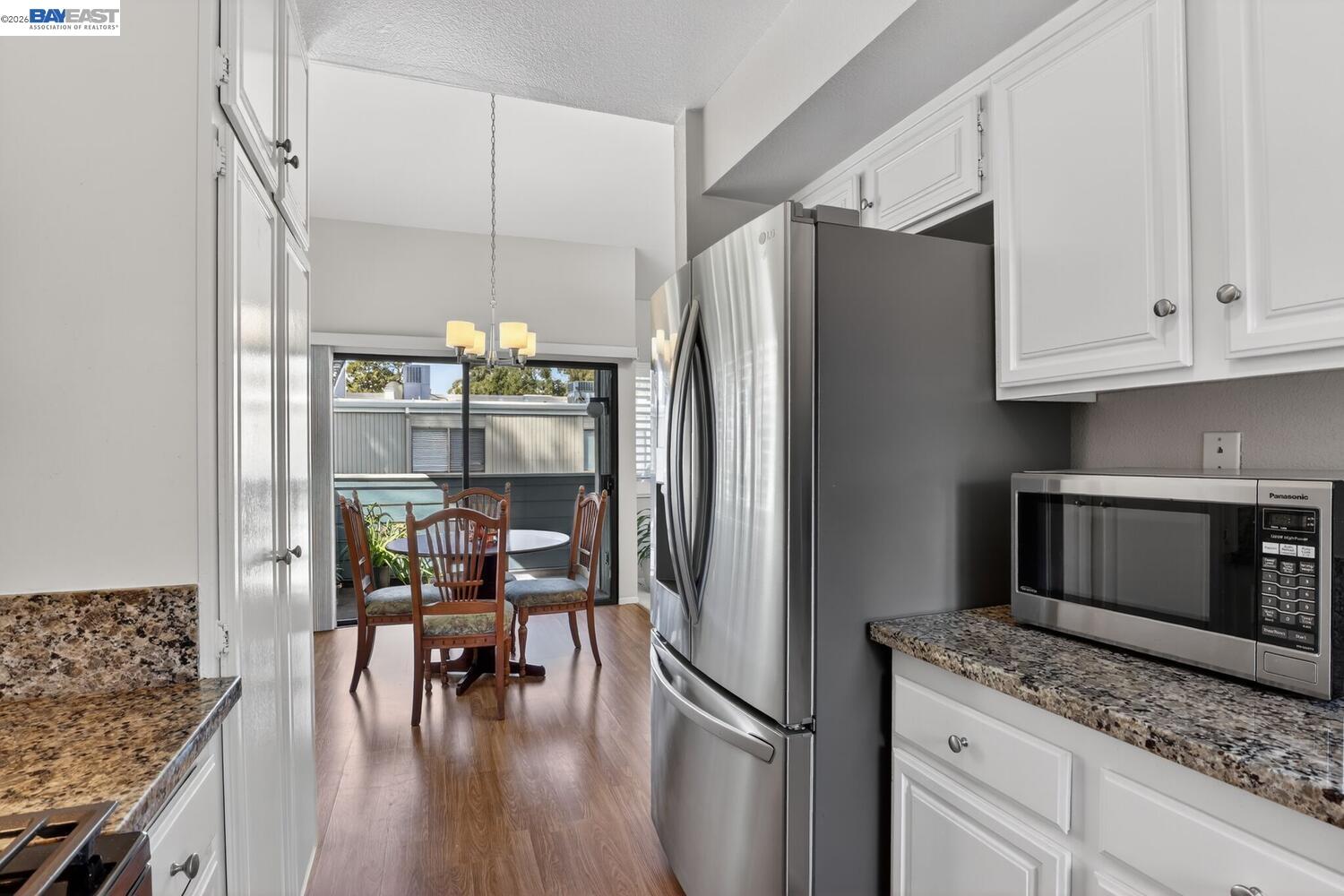 218 Apollo, Unit 3 Hercules, CA 94547 - Photo 15 of 36 View of the dining area and balcony from the kitchen.
