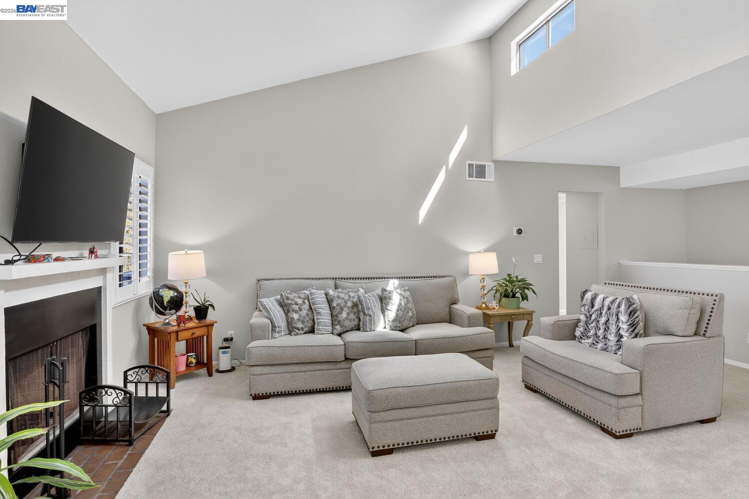 218 Apollo, Unit 3 Hercules, CA 94547 - Photo 7 of 36 Featuring vaulted ceilings, new carpet, gas fireplace, and plantation shutters.