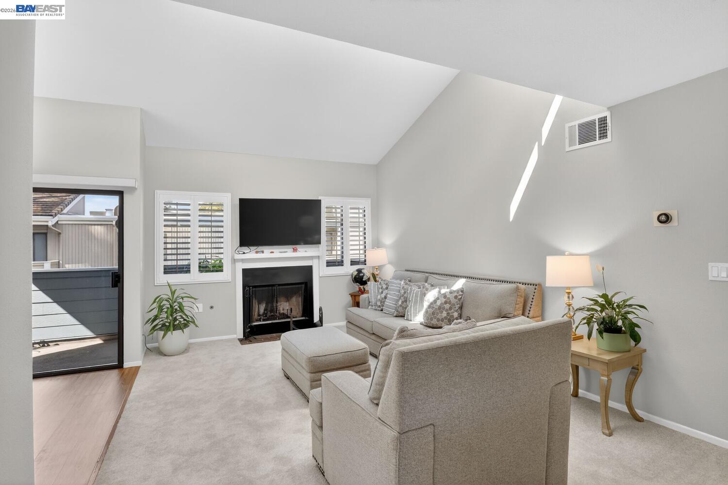 218 Apollo, Unit 3 Hercules, CA 94547 - Photo 8 of 36 Nest thermostat on the wall, balcony just off the dining area.