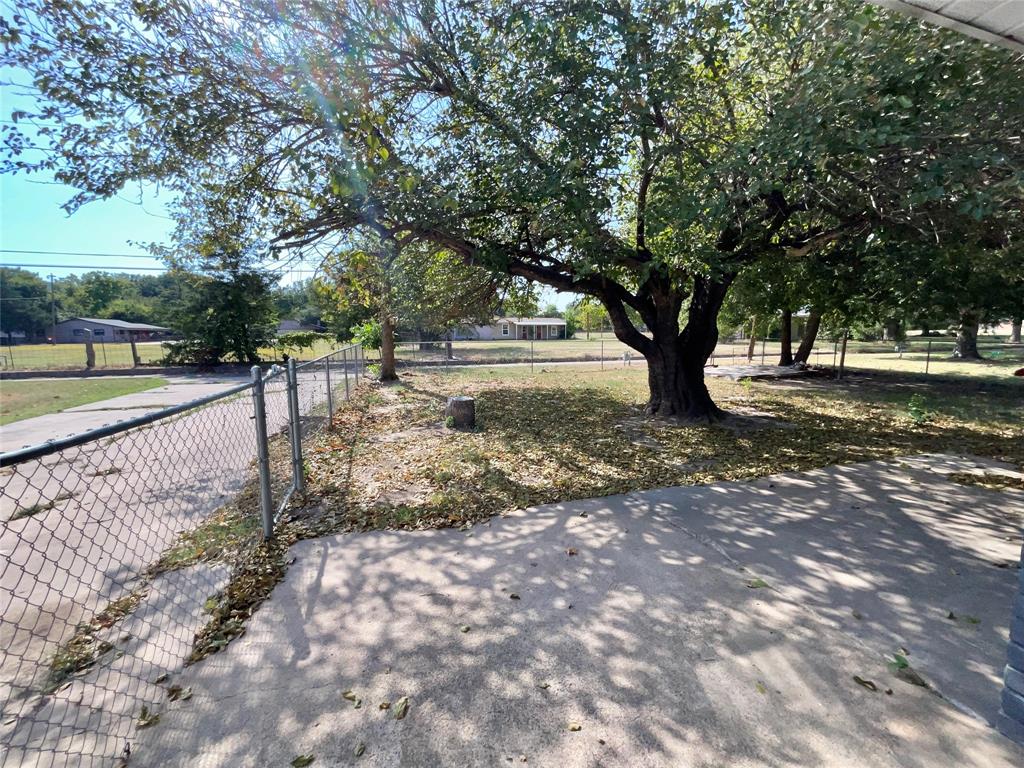 3008 Arapaho Road Commerce, TX 75428 - Photo 25 of 32 Backyard and private driveway