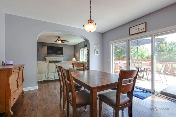a view of a dining room with furniture window and wooden floor
