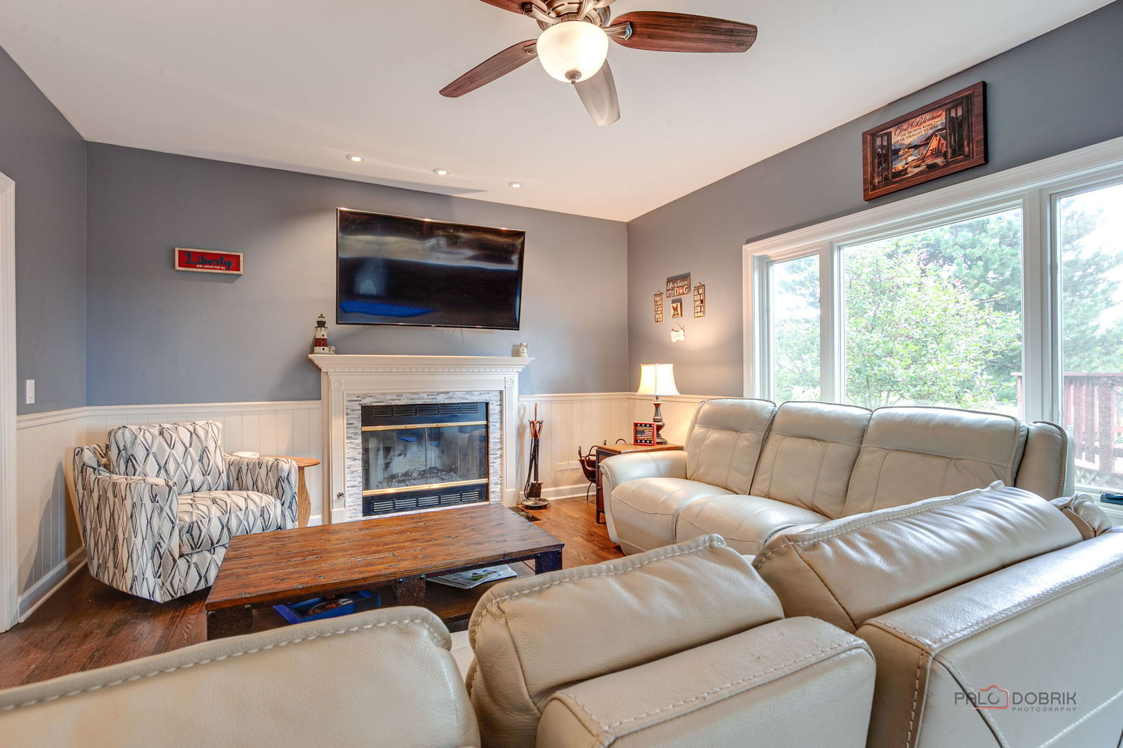 3313 Ridge Road Spring Grove, IL 60081 - Photo 13 of 49 a living room with furniture a flat screen tv and a fireplace